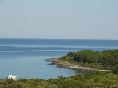 an island in the middle of a body of water at VILLA 4pers, STUNNING SEA VIEW, BEACH ON FOOT 4* in Olmeto