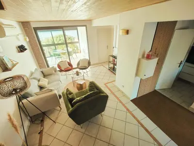 an overhead view of a living room with a couch and chairs at Charmante petite maison magnifique vue mer in Propriano