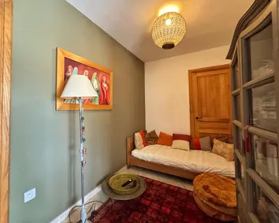 a bedroom with a bed and a lamp in it at Villa Casa Bianca Sagone Piscine privée et Vue mer Familiale in Sagone