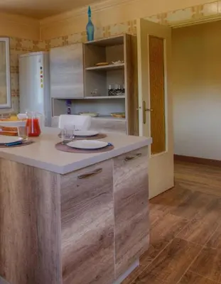 a kitchen with a white counter top in a room at Casa santoni 20 in Grosseto-Prugna