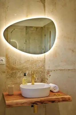 a bathroom with a sink and a mirror at COCO in Venaco