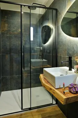 a bathroom with a sink and a shower at COCO in Venaco