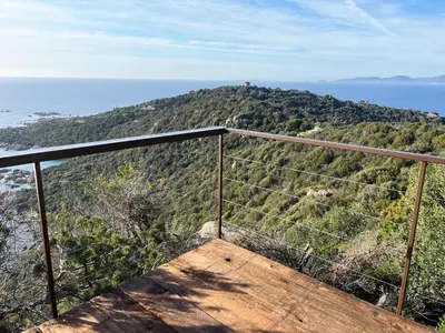 a view of a hill with the ocean in the background at Domaine de la Coletta Bergerie in Coti-Chiavari