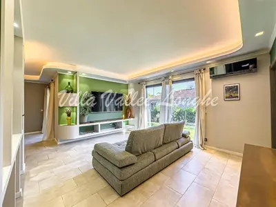 a living room with a couch and a table at Villa Talasani in Talasani
