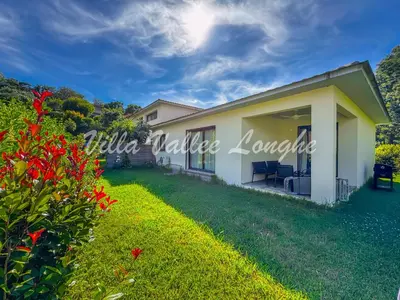 a villa with a garden and a house at Villa Talasani in Talasani