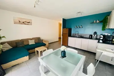 a living room with a couch and a table at Nice 60m With Terrace In Ajaccio in Ajaccio
