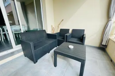 a living room with two chairs and a table at Nice 60m With Terrace In Ajaccio in Ajaccio