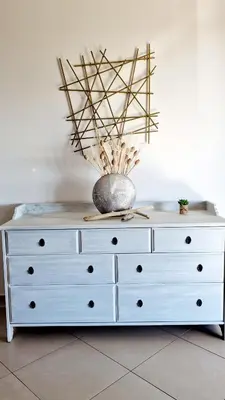 a white dresser with a vase on top of it at Villa Bistinetti Rez de villa tout confort avec piscine in Penta-di-Casinca