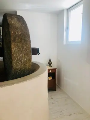 a large rock sitting on a wall in a room at U Vechju Fragnu in Vezzani
