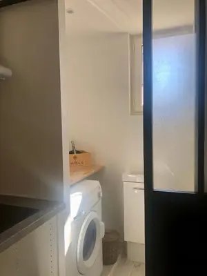 a small bathroom with a toilet and a sink at U Vechju Fragnu in Vezzani