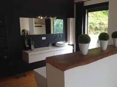 a bathroom with a sink and a mirror at Villa St Exupery in Oletta