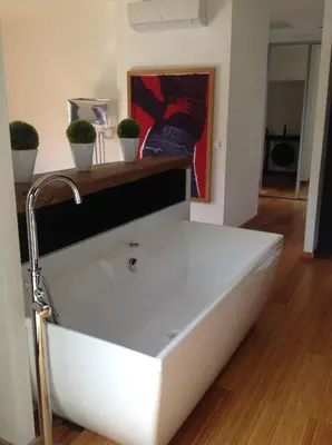 a white sink in a room with potted plants at Villa St Exupery in Oletta