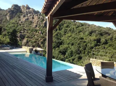 a view from the deck of a house with a swimming pool at Villa St Exupery in Oletta