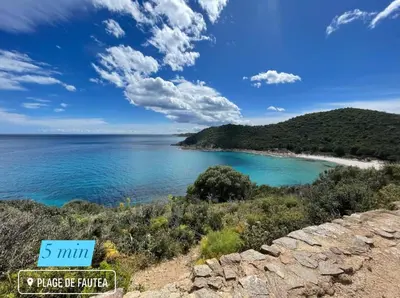 a view of a beach with a sign that reads min and a beach at Duplex vue mer EXCEPTIONNELLE en Corse du sud proche plage - le 180Corse in Conca