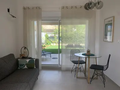 a living room with a couch and a table at Résidence Casa Olea - Studio - T2 - T3 in Cauro