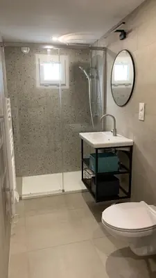 a bathroom with a shower and a toilet and a sink at Résidence Casa Olea - Studio - T2 - T3 in Cauro