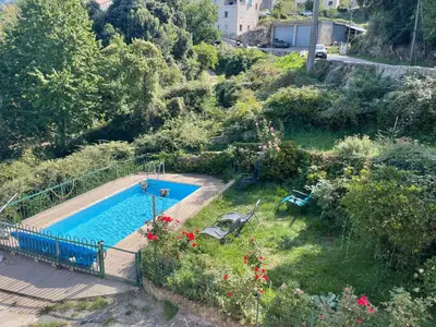 an image of a swimming pool in a garden at chez marie jo Chez marie jo in Cozzano