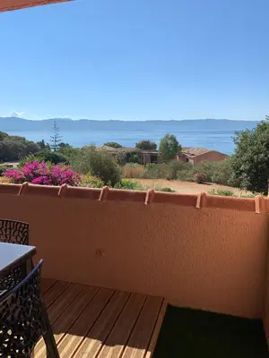 a balcony with a view of the ocean at Appartement « Marinella » splendide vue mer aux Sanguinaires in Ajaccio
