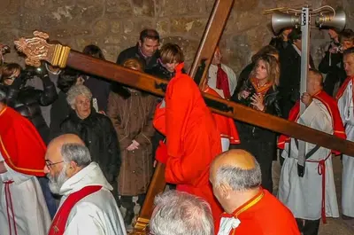 a group of men in red robes standing in a crowd at SARTENE t3 CALME ENSOLEILLÉ PARKING PRIVÉ in Sartène