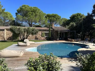 a swimming pool in front of a house at Maison 1 in Porto-Vecchio