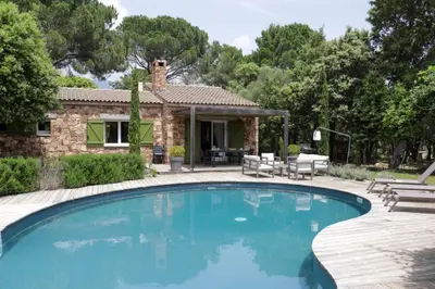 a swimming pool in front of a house at Maison 1 in Porto-Vecchio