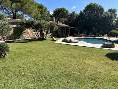 a yard with a swimming pool and a house at Maison 1 in Porto-Vecchio