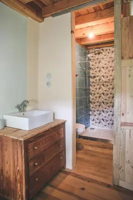a bathroom with a sink and a shower at Eco lodge Carbonaccio in Chiatra