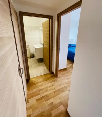 a bathroom with a toilet and a sink and a mirror at Ajaccio T2 grand standing neuf vue mer centre-ville & plages in Ajaccio