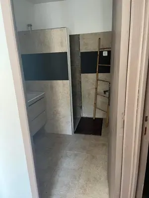 a bathroom with a shower and a sink and a mirror at Campana in Sartène