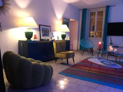 a living room with a couch and a table at Spacieux et confortable appartement T3 au centre ville d Ajaccio in Ajaccio