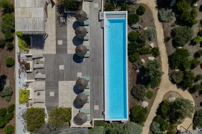 an overhead view of a swimming pool in a resort at VILLA FLAKA Boutique Hôtel Wellness in Cargèse