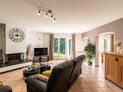 a large living room with a couch and a tv at Villa Corba Bala by Interhome in Porto-Vecchio