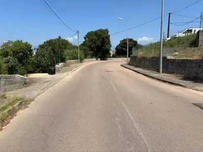 an empty road with a fence on the side at Maison de charme à Ajaccio avec terrasse et jardin in Ajaccio