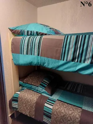 a bunk bed with two pillows on top of it at Vista Mare Ghisonaccia in Ghisonaccia