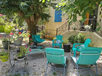 a group of chairs and tables in a garden at Casa Maria in Vico