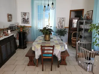 a kitchen with a table with a plant on it at Casa Maria in Vico