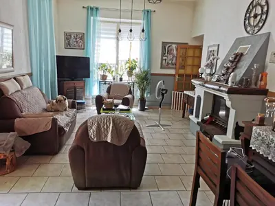 a living room with a dog laying on a couch at Casa Maria in Vico