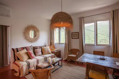 a living room with a couch and a table at Maison A Luna in Palasca