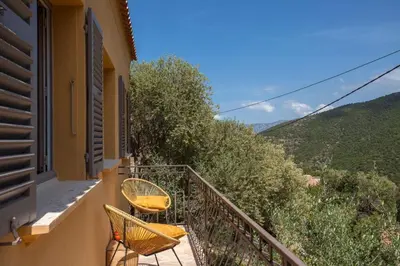 a pergola with a table on a patio at Maison A Luna in Palasca
