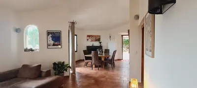 a living room with a couch and a table at Gianni Location Palombaggia in Porto-Vecchio