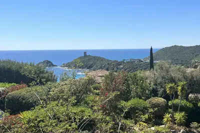 a view of the ocean with a lighthouse on a hill at Villa Surella Di Fautea in Conca