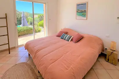 a large orange bed in a room with a window at Villa Surella Di Fautea in Conca