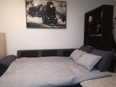 a bed in a room with a train on the wall at Esperanza in Moriani Plage