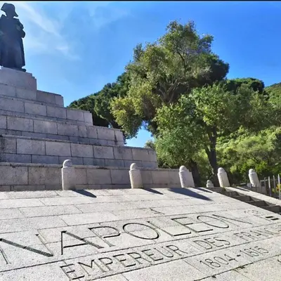 a sign on the steps of a monument at Bel F2 près de la plage in Ajaccio