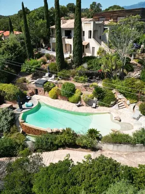 an overhead view of a swimming pool in a resort at Sunrise T2 avec jacuzzi vue mer in Porto-Vecchio
