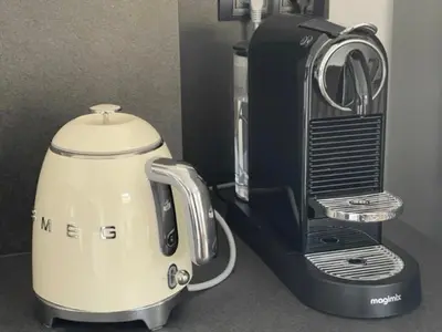 a white and black blender sitting on a counter at le Pied à Terre 2 PORTICCIO in Porticcio