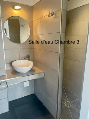 a bathroom with a sink and a mirror at le Pied à Terre 2 PORTICCIO in Porticcio