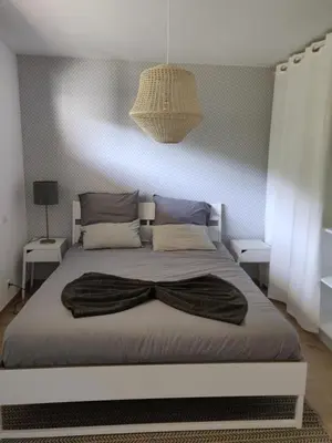 a bedroom with a bed with a blanket on it at Villa ARIA et MAQUIS, Villa 4 chambres- Piscine - Plage à pied - vue mer in Pietrosella