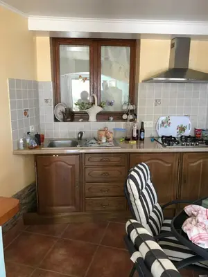 a kitchen with a sink and a counter top at Studio de 39 m2 in Vezzani