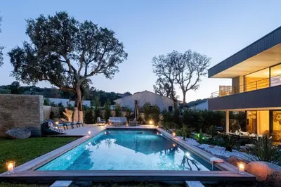 a swimming pool in the backyard of a house at Villa Renajolo 16 pers piscine chauffée 2 min plage en voiture in Sainte-Lucie de Porto-Vecchio